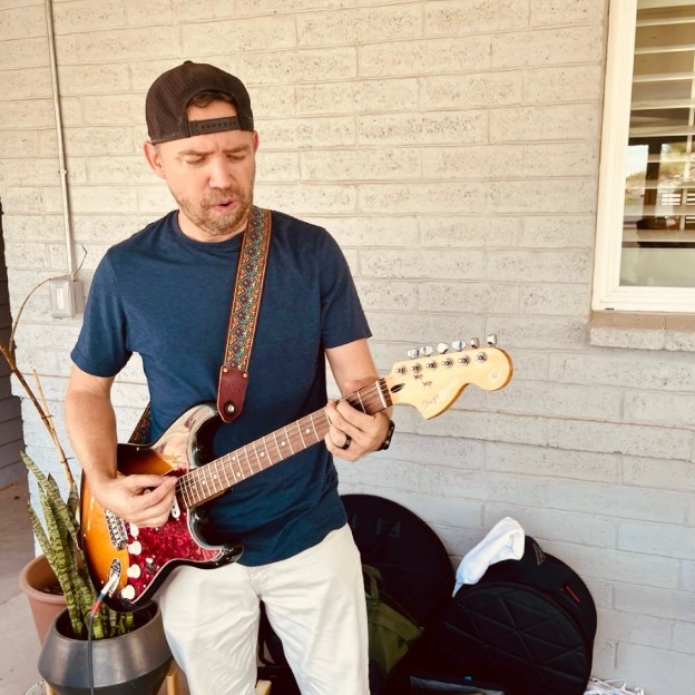 Shad Parker playing on the patio