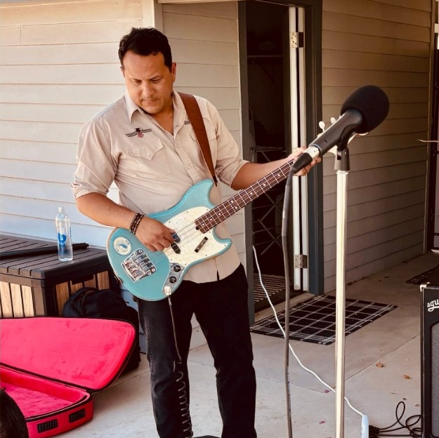 Marco Bravo playing on the patio