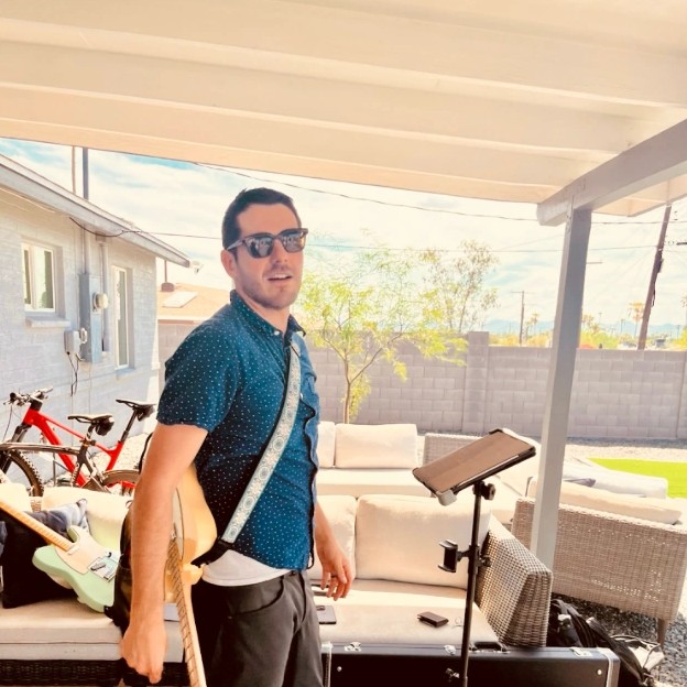 Justin Rodriguez playing on the patio