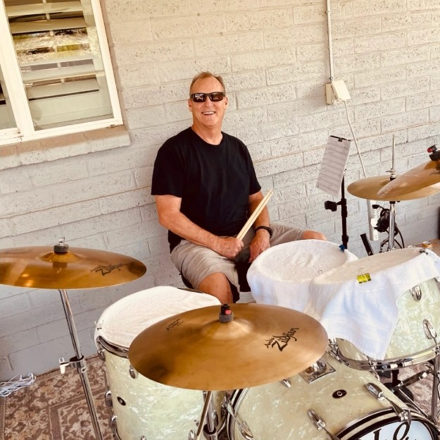 Keith Edwards playing on the patio
